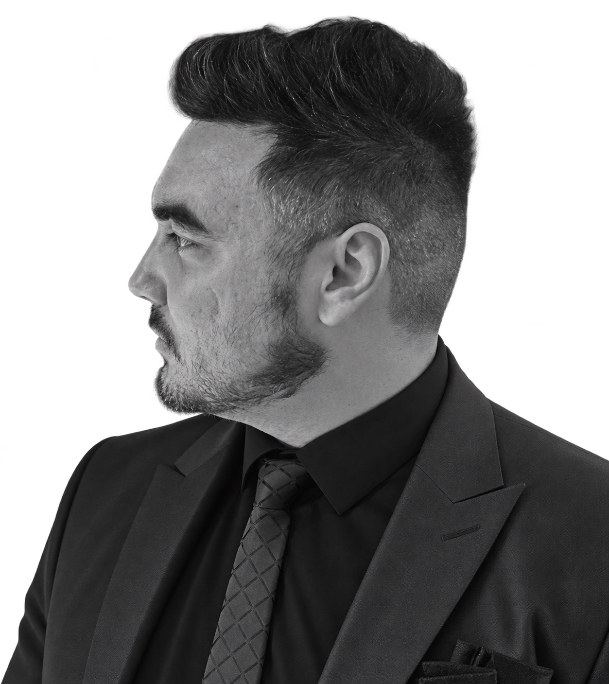 Connor Gilliland in a suit, facing toward the introduction